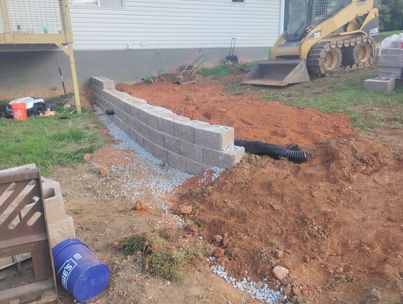 Natural boulder retaining wall built by The Wall Guy on a Georgia hillside property