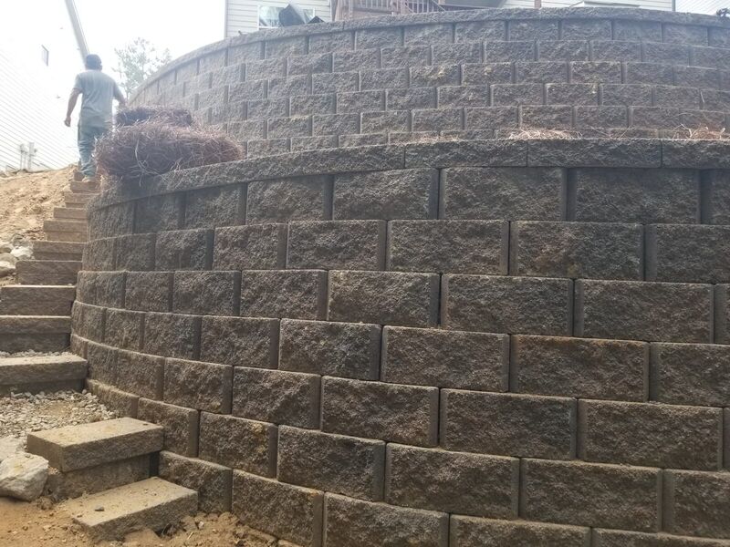 Multi-tiered curved block retaining wall built by The Wall Guy in North Georgia