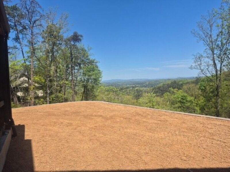 Graded building pad on a hillside prepared by The Wall Guy crew